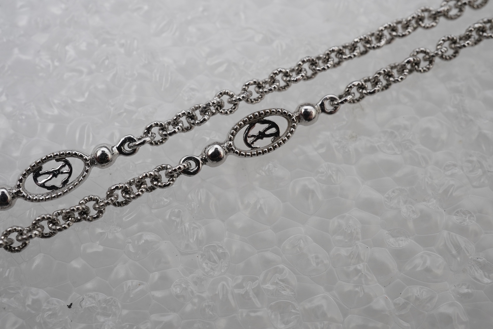 A diamond lariat necklace